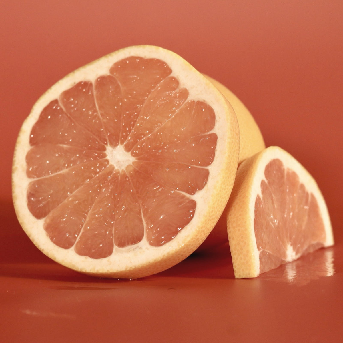 A halved grapefruit, the bright citrus note of N° 02 Goddess of Earth